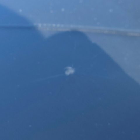 The same windshield after the chip was repaired