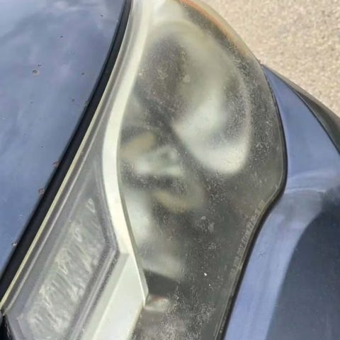 Oxidized, hazy headlight lens before restoration